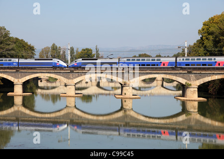 French high speed train TGV crossing the bridge in Beziers, France Stock Photo