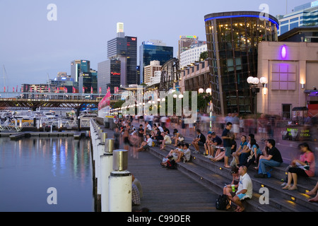 Crowds line the waterfront at Cockle Bay Wharf. Darling Harbour, Sydney, New South Wales, Australia Stock Photo