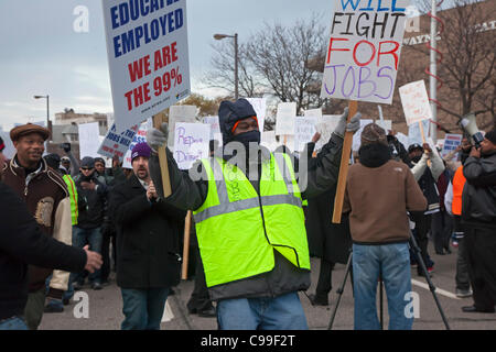 Detroit, Michigan - Supported by members of the Service Employees International Union and the United Auto Workers, members of the 'occupy' movement block a crumbling bridge to demand passage of President Obama's American Jobs Act. Stock Photo