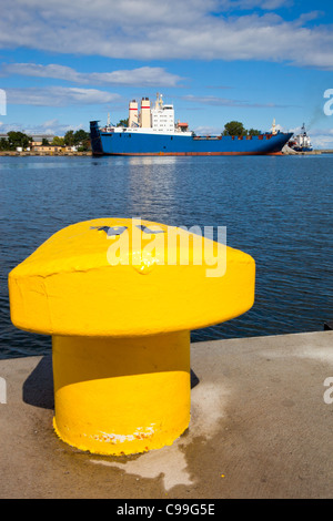 Bitts yellow against a background of moored ship. Gdynia, Poland. Stock Photo