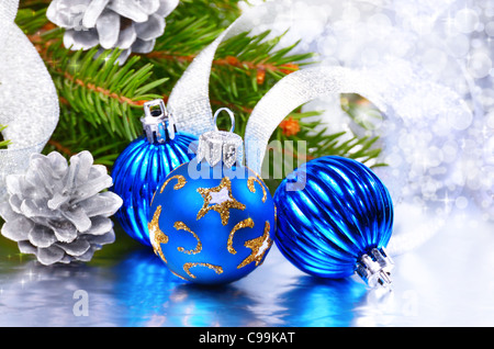 Blue and silver Christmas balls over bright background Stock Photo - Alamy