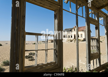 View from the veranda of an abandoned house in Kolmanskop a former diamond mine in Namibia Stock Photo
