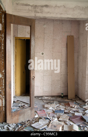 Piles of books scattered over the floor of the Palace of Culture Lenin Square, Pripyat Chernobyl exclusion zone Ukraine Stock Photo