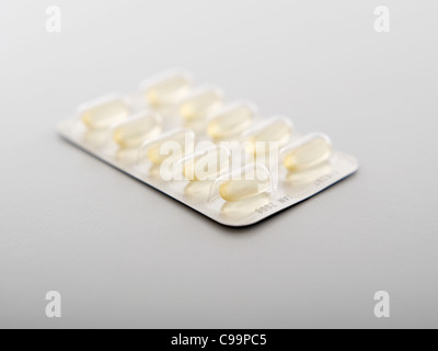Pills in blister pack on white background, close up Stock Photo