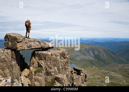 Hiker atop Cradle Mountain in Tasmania's central highlands. Cradle Mountain-Lake St Clair National Park, Tasmania, Australia Stock Photo