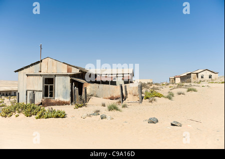 Abandoned factory in Kolmanskop the former mining town in Namibia Stock Photo