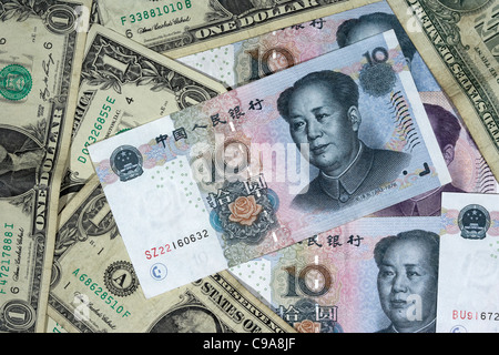 chinese renminbi rmb on top of usa dollars banknotes Stock Photo
