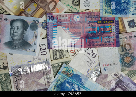 multiple currencies including chinese renminbi rmb hong kong dollars us dollars british pounds and euro banknotes Stock Photo