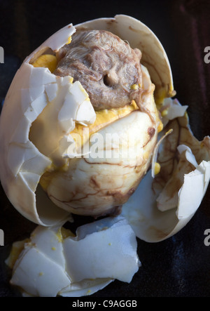 Balut Egg - an Asian street food delicacy - An example of the strange or weird food eaten by people around the world Stock Photo