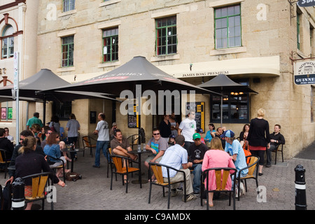 People enjoying a drink on the Hobart waterfront at Salamanca Place. Hobart, Tasmania, Australia Stock Photo