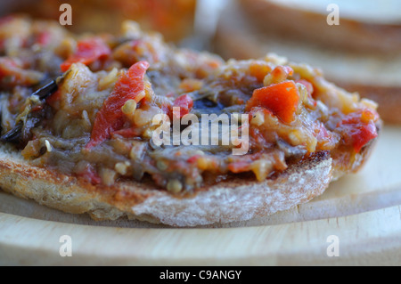 Roasted eggplant spread with bread toasts Stock Photo