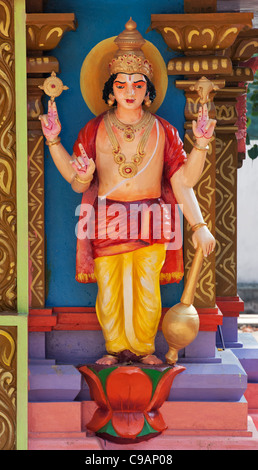 Vishnu statue on a colourful Hindu Hanuman temple. Andhra Pradesh, India Stock Photo