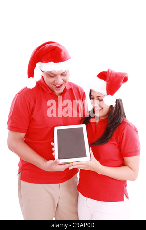 Couple enjoying their new touchpad on christmas Stock Photo