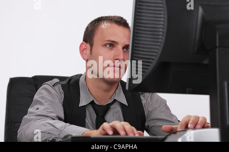 Image of a young businessman working on his computer. Stock Photo