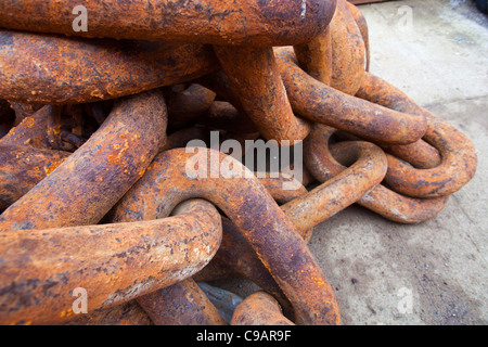 Old rusty anchor chain on the jetty in Stromness, Orkney, UK. Stock Photo