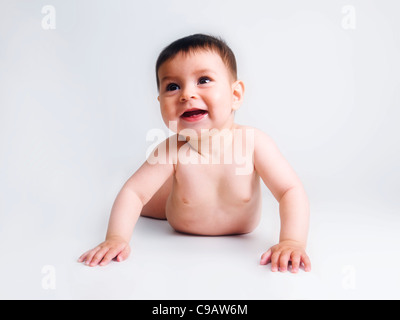 5 month baby boy on stomach lifting chest happy smiling Stock Photo