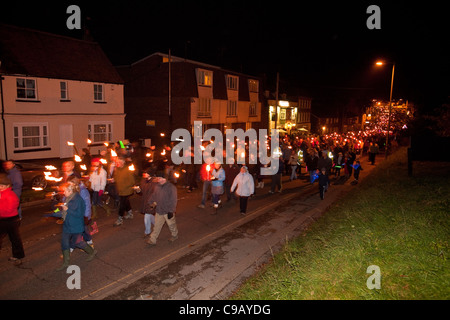 Torchlight procession along Broad street on bonfire night, New Alresford,Hampshire, England, United Kingdom. Stock Photo