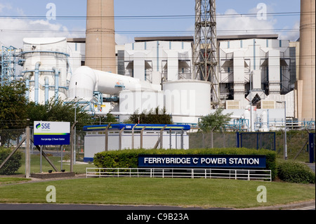 Main entrance to Ferrybridge 'C' Power Station (large name signs, industrial buildings & chimney stacks) - Knottingley, West Yorkshire, England, UK. Stock Photo