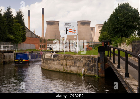 Cooling towers & chimneys of Ferrybridge 'C' Power Station & narrow boat sailing on Aire and Calder Navigation Canal - West Yorkshire, England, UK. Stock Photo