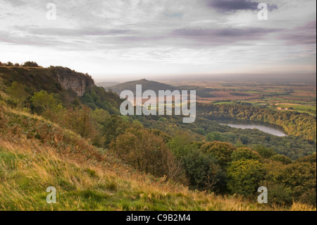 Beautiful scenic long-distance view over Lake Gormire, Hood Hill, Whitestone Cliff & countryside sunrise - Sutton Bank, North Yorkshire, England, UK.
