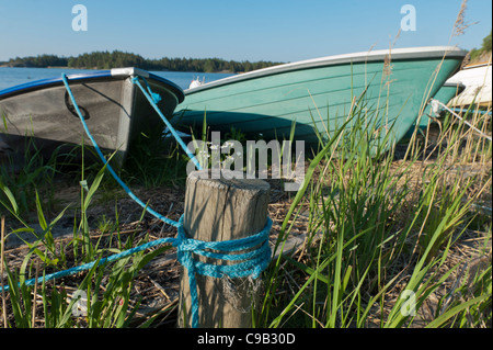 Tied rowing boats Aland Island Finland Stock Photo
