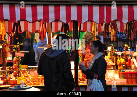 Young couple at German Christmas Market, Market Square, Kingston upon Thames, Greater London, England, United Kingdom Stock Photo
