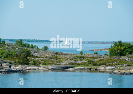 Yacht and speed boat cruising the Åland Islands Finland Stock Photo