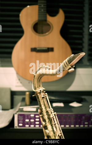 Saxophone and guitar in a recording studio Stock Photo