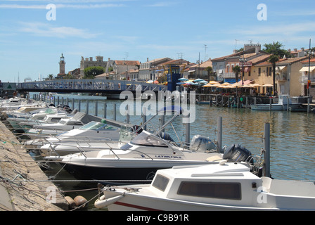 Boats moored on the canalised Vidourle river at the Mediterranean holiday resort Le Grau du Roi in Camargue,Languedoc-Roussillon Stock Photo