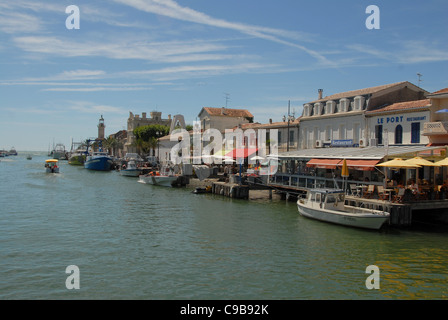 The fishing port and seaside resort Le Grau-du-Roi is divided by the canalised Vidourle river to the Mediterranean. Stock Photo