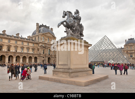 Louis XIV equestrian statue on plinth, The Louvre central courtyard, Paris, France Stock Photo