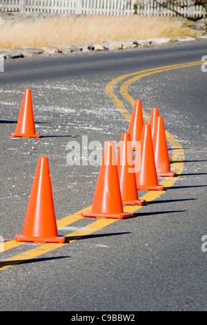 Traffic Cones on Double Yellow lines on a beach road in Connecticut USA Stock Photo