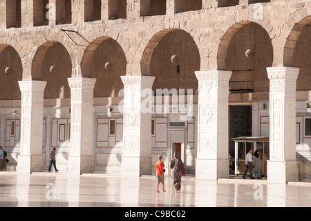 Visitors in the open-air courtyard of the Umayyad Mosque in the old city of Damascus, Syria.