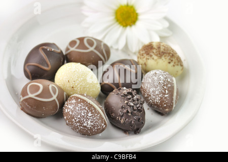 assortment of chocolate eggs on a plate Stock Photo