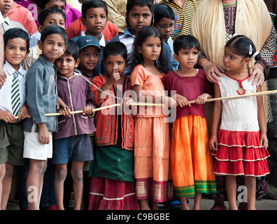 Indian school children in a crowd on the street of Puttaparthi, Andhra ...