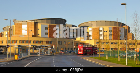 Winter view of Queens Hospital buildings (built under a Private Finance Initiative) and bus stops at Romford Stock Photo