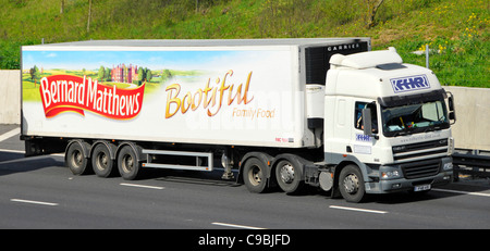 DAF CF hgv lorry truck & Bernard Matthews name side of articulated trailer advertising Bootiful poultry business he founded driving on UK M25 motorway Stock Photo