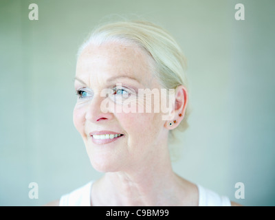 Senior woman looking away, smiling Stock Photo
