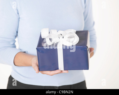 Senior woman with gift box Stock Photo