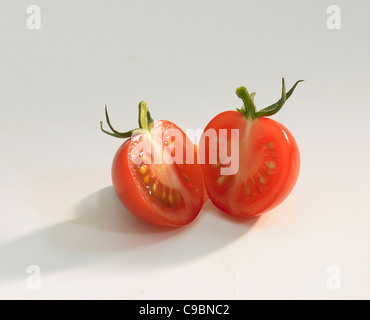 Sliced tomatoes on white background Stock Photo