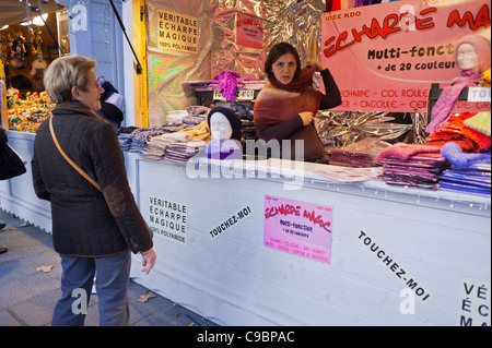 Paris, France, Woman Shopping in 'Champs Elysees' Christmas Market, Street Vendor selling WInter Scarfs Stock Photo
