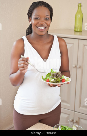 Pregnant woman eating salad, Johannesburg, Gauteng Province, South Africa Stock Photo