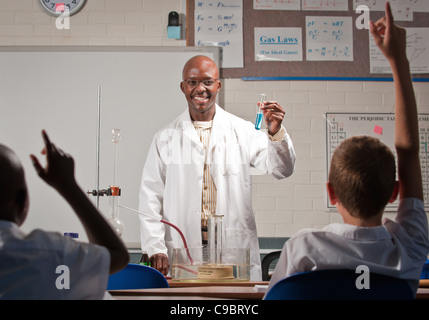 Male science teacher in class of young boys, Johannesburg, Gauteng Province, South Africa Stock Photo