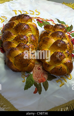 Fresh backed challahs cooling on Shabbos bread-cover Stock Photo