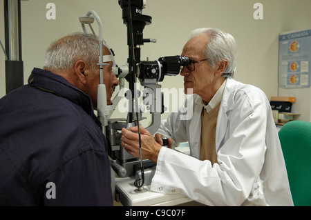 Doctor performing eye test on a patient Stock Photo