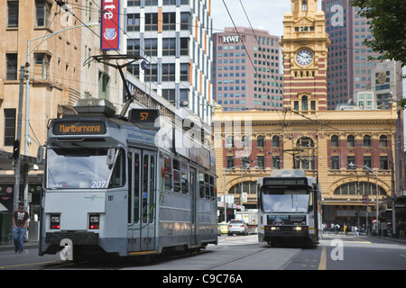 Tram on Elizabeth Street Melbourne Australia, trams public transport systems with Flinders Railway Station in the background. Stock Photo
