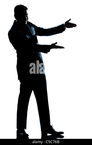 one  man showing pointing empty copy space full length silhouette in studio isolated white background Stock Photo