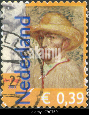 NETHERLANDS 2003: A stamp is dedicated to the 150th anniversary of Vincent Van Gogh, shows a self-portrait in a straw hat Stock Photo