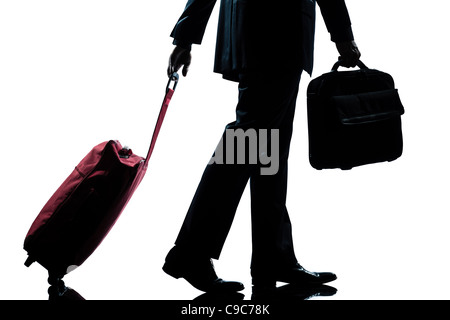 detail side view one  business traveler man walking with suitcase full length silhouette in studio isolated white background Stock Photo