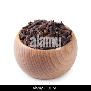 Wooden bowl full of cloves isolated on white background Stock Photo